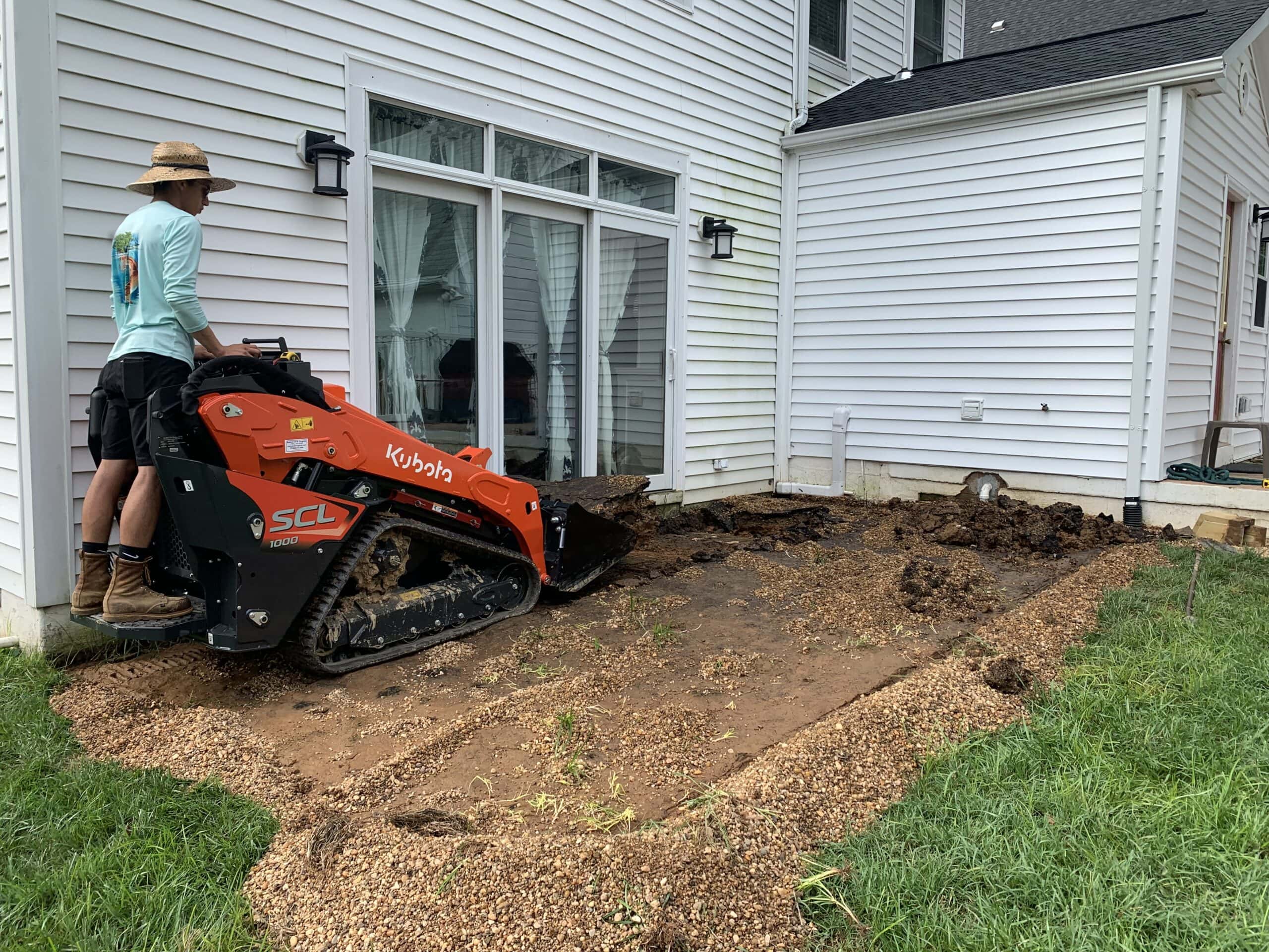 Compact stand-on track loader