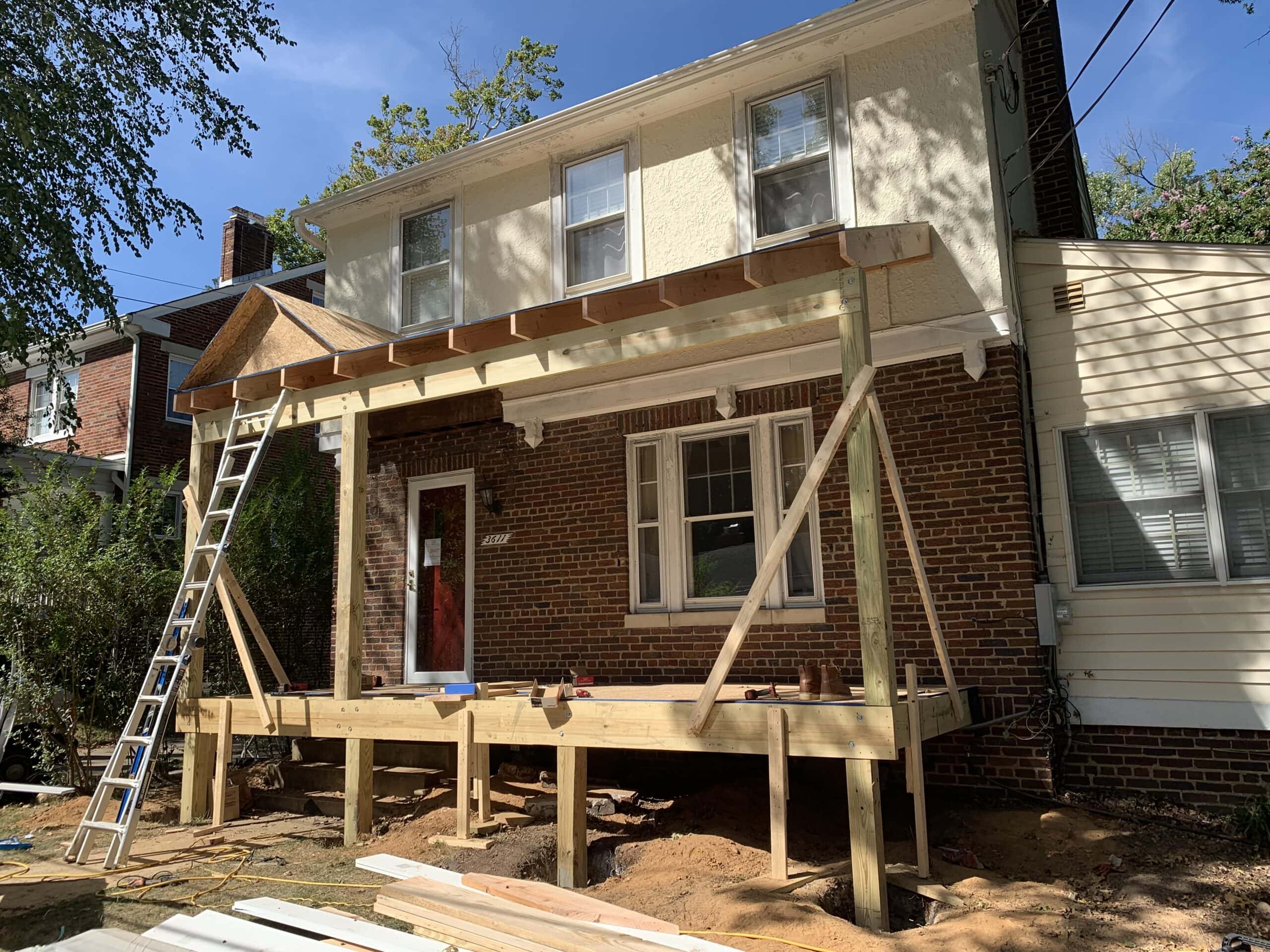 Progress continues on front porch build with roofline taking shape.