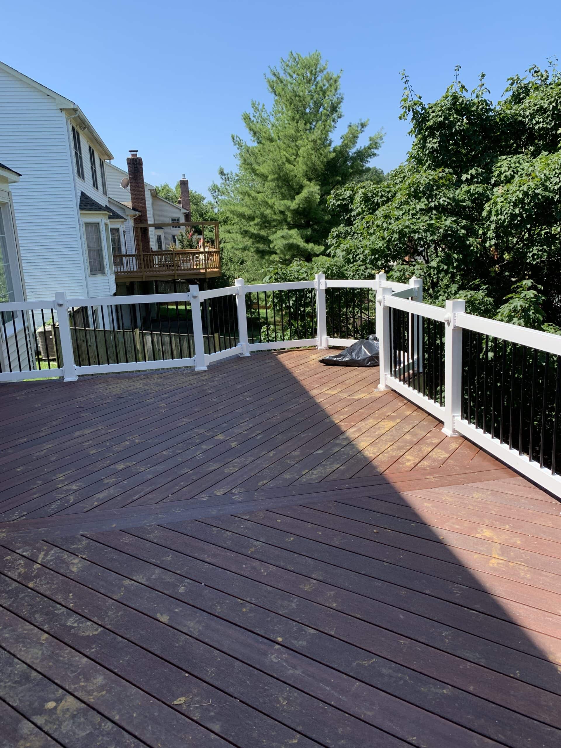 Warm composite decking with clean white vinyl railings