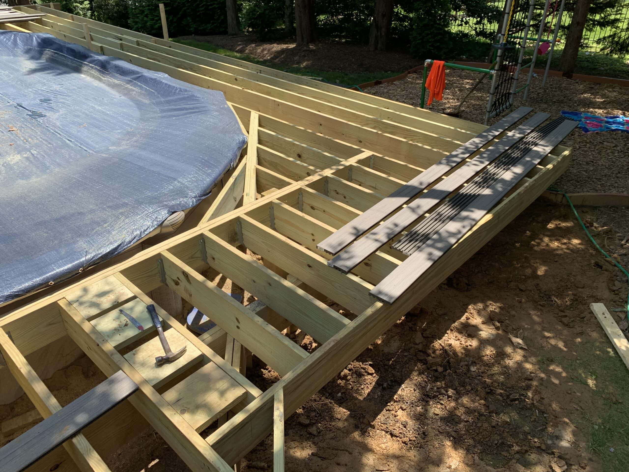 Detail view of curved framing supporting future custom deck around pool