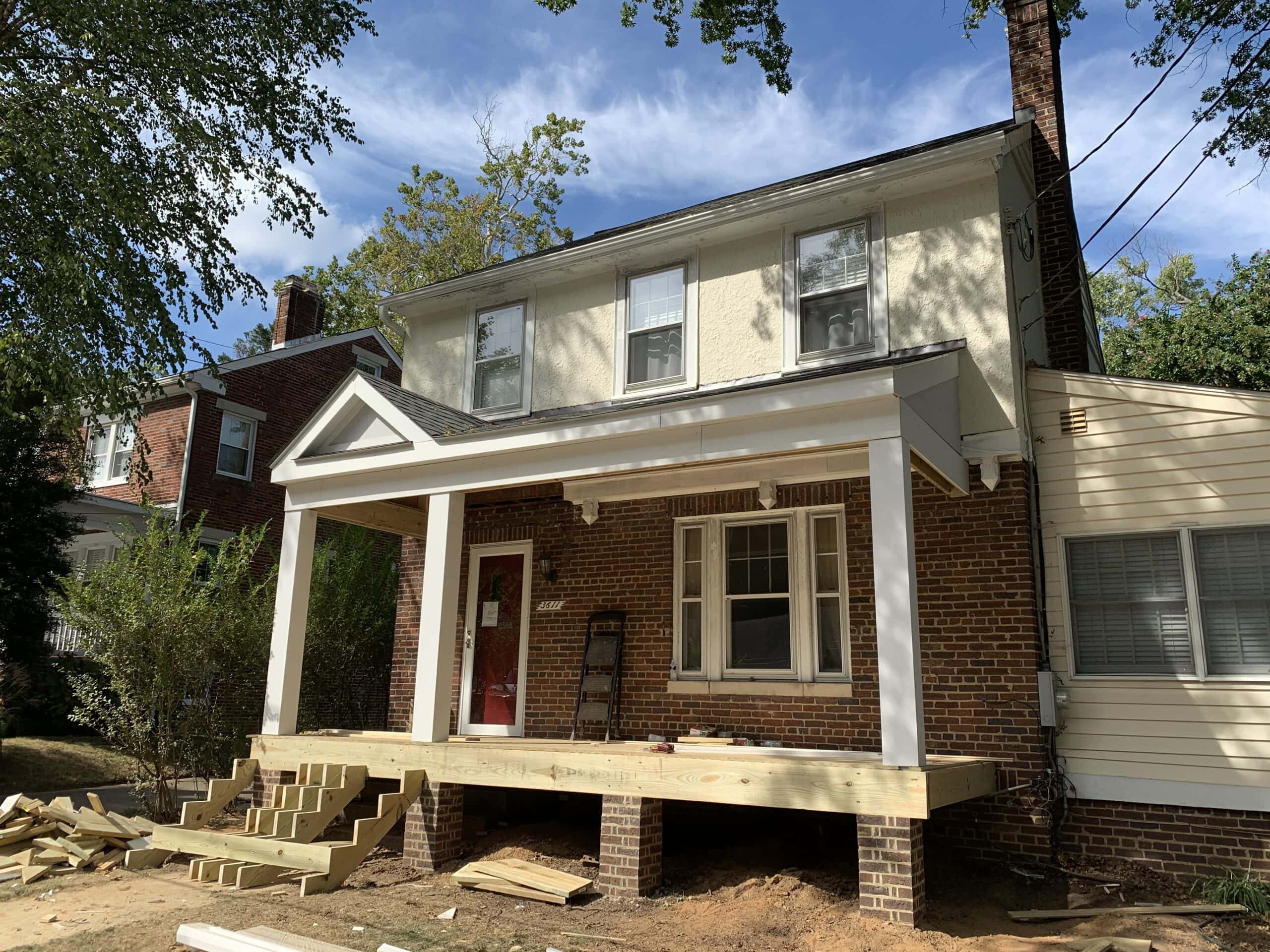Columns and trim added to front porch, showing progress toward classic design.