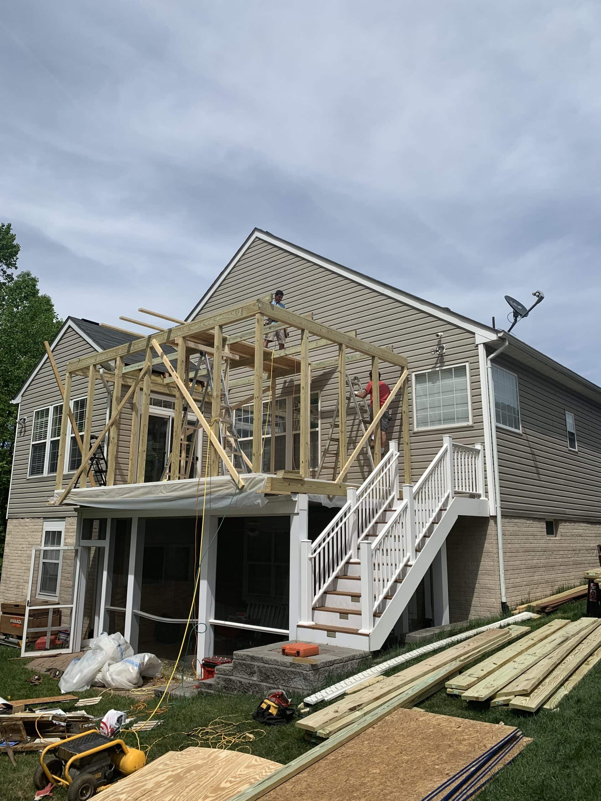 Full porch framing completed with roof structure and support beams in place