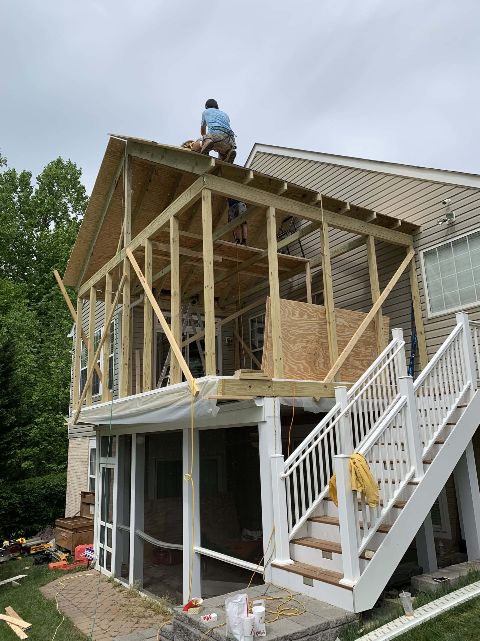 Sheathing and wall structure added to porch build for insulation and window installation