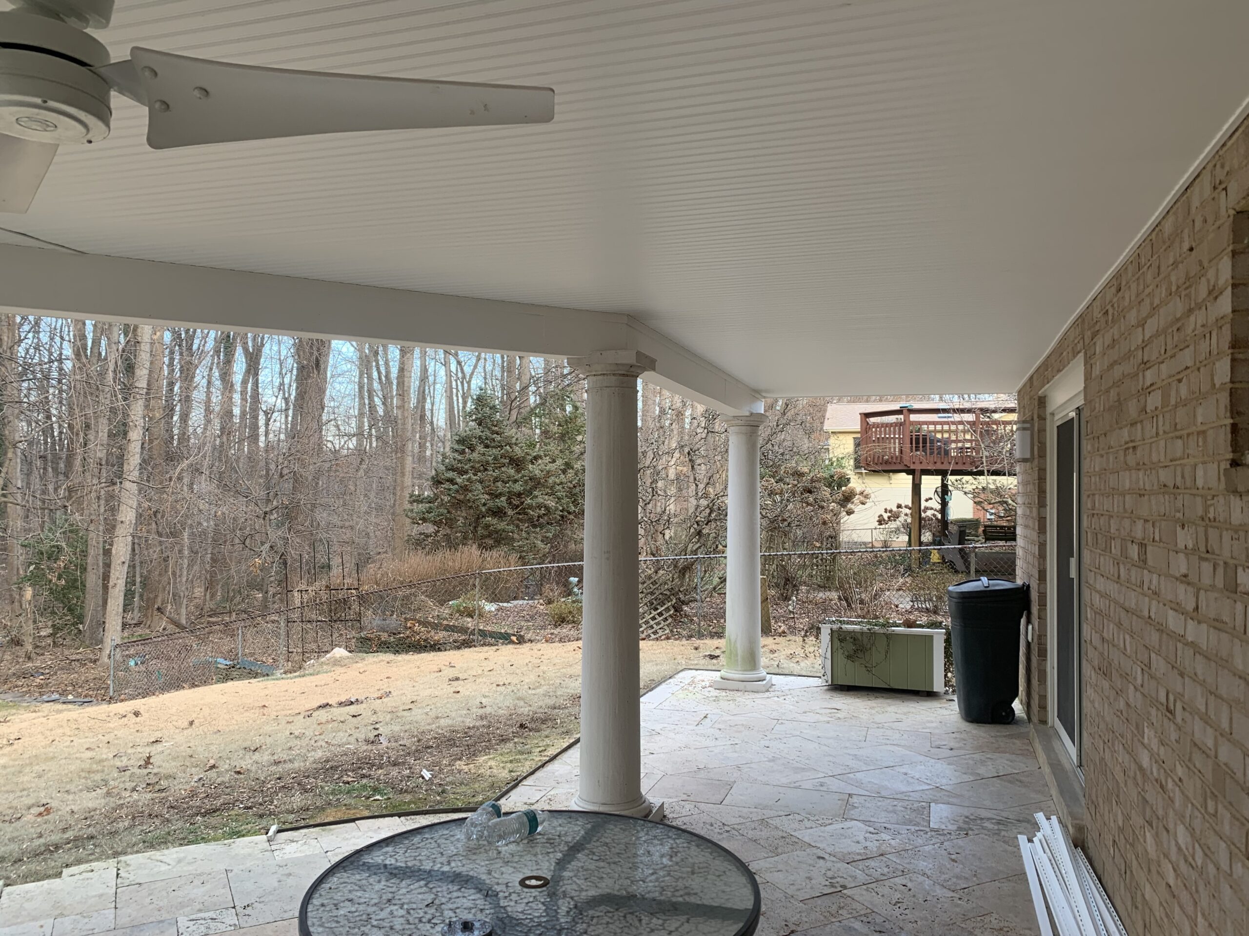 A patio with a table and chairs
