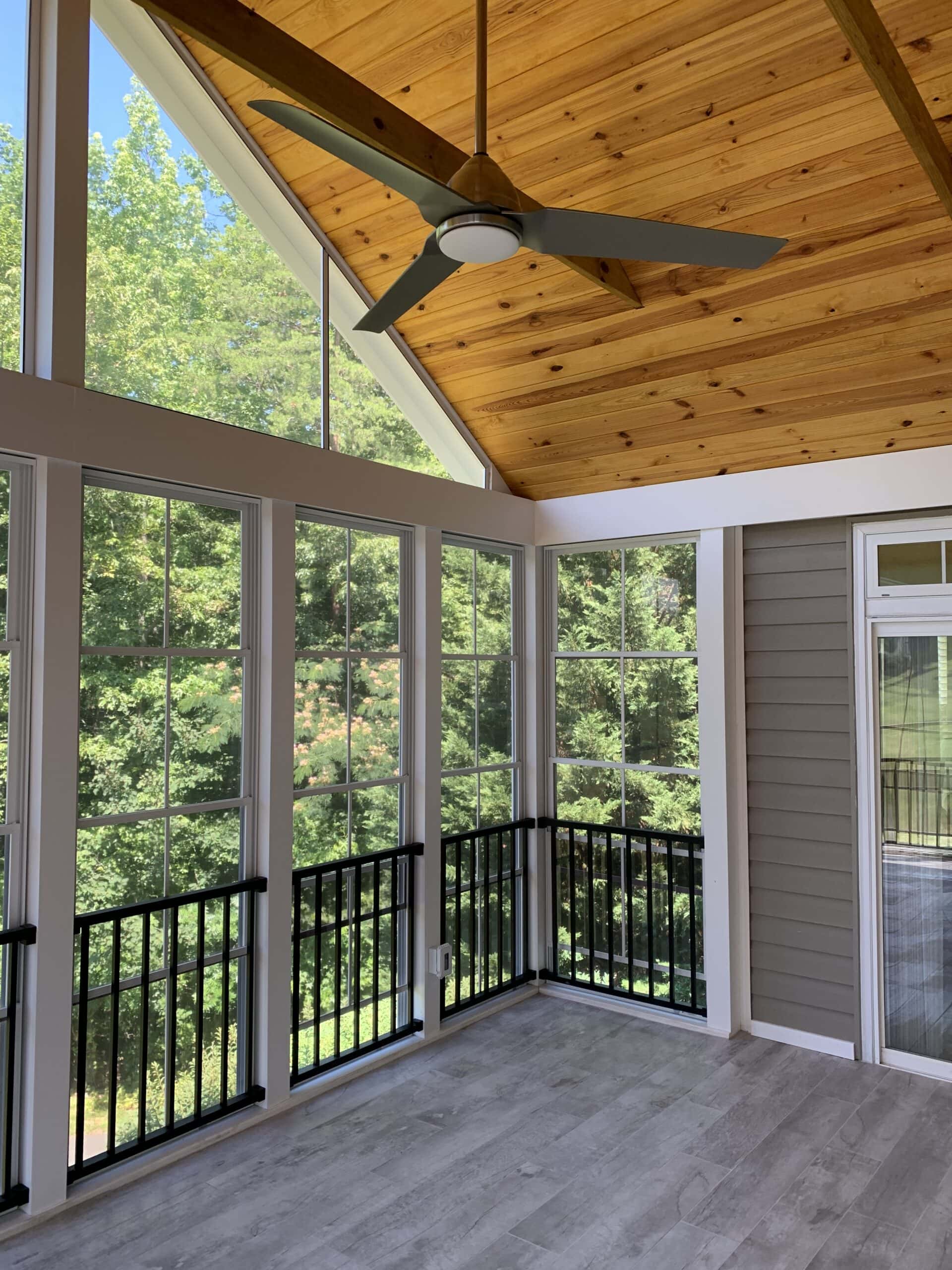 The interior features a tongue-and-groove pine ceiling