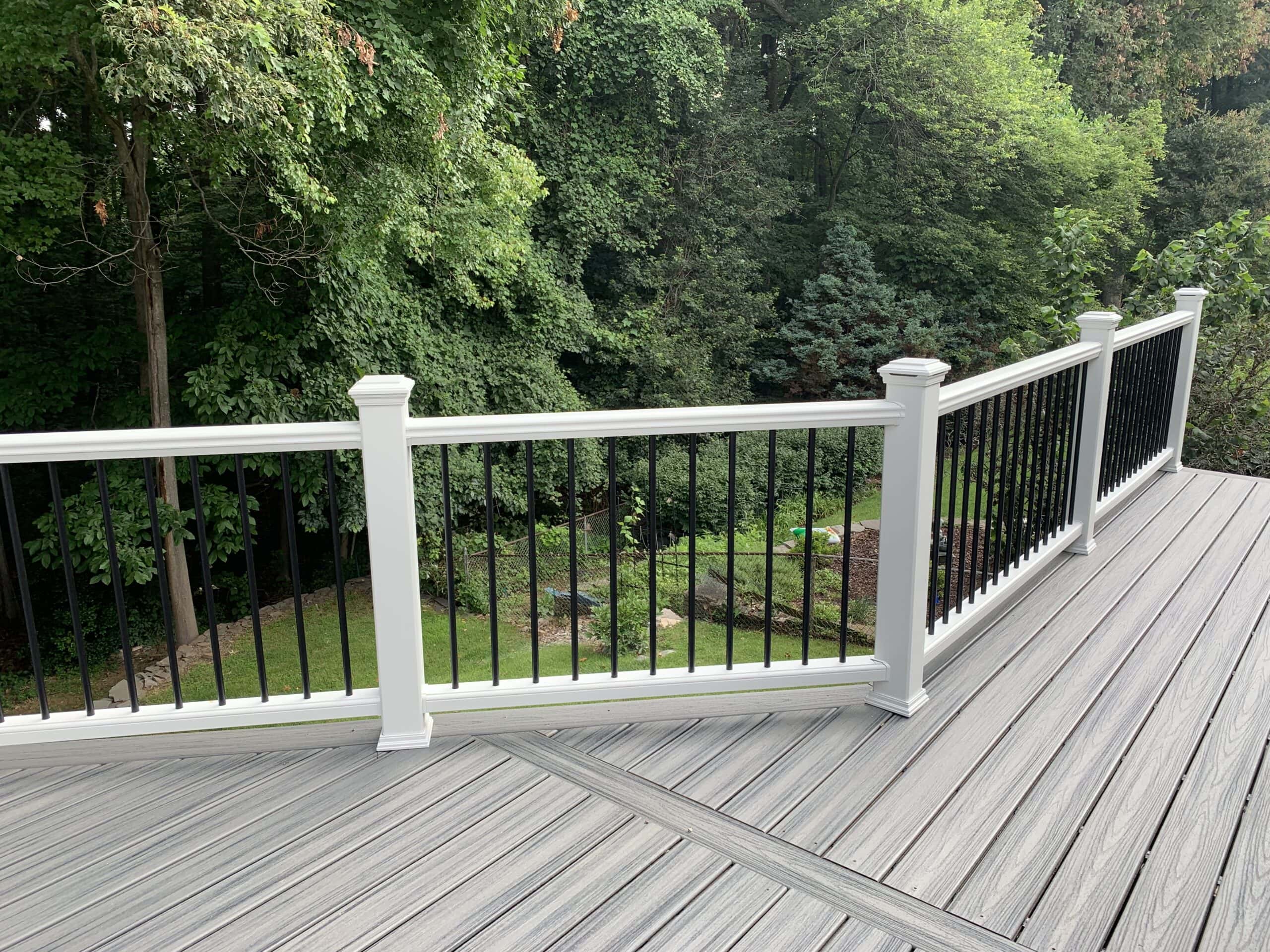 A deck with a railing and a deck railing.