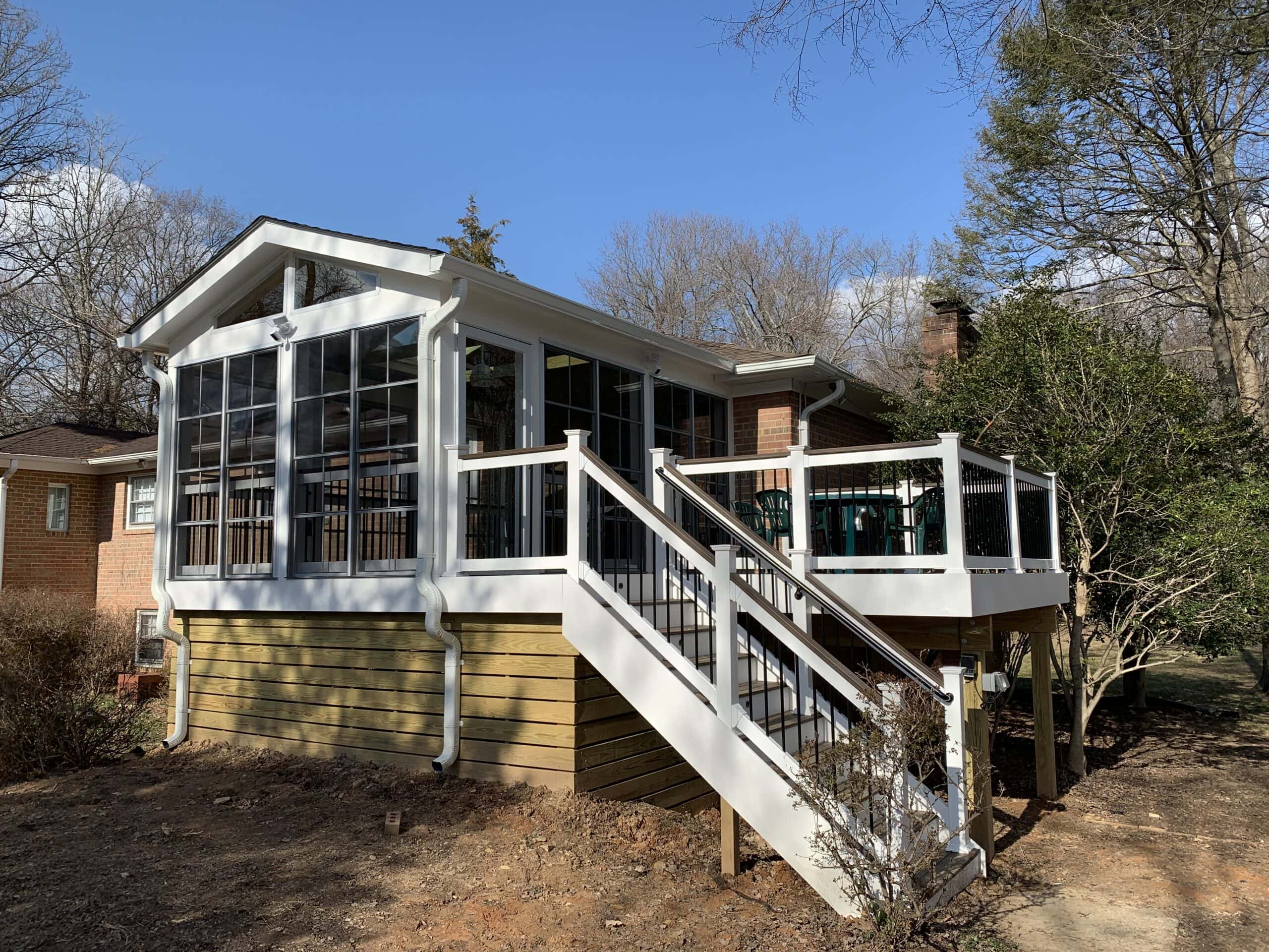 Side view of the new three-season room and deck, highlighting the fresh, modern design and improved functionality for outdoor living.